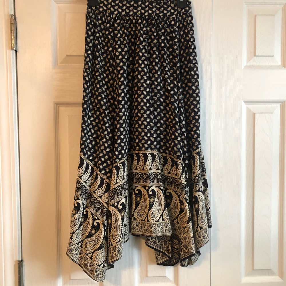 Long black and cream colored floral skirt.